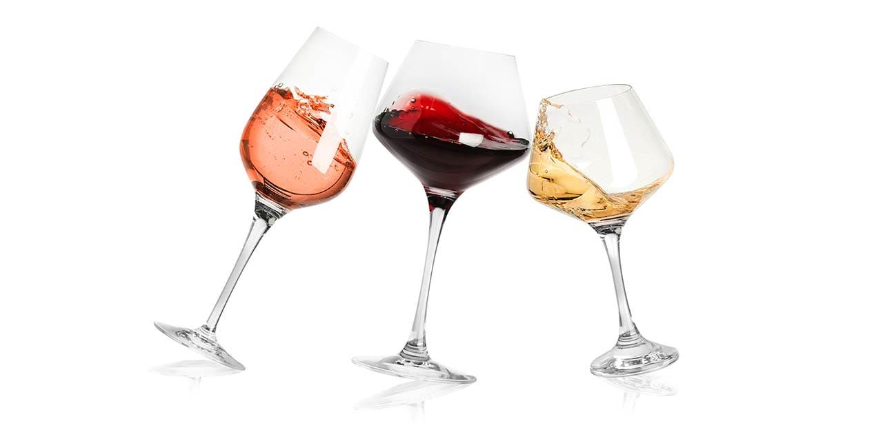 wine glasses filled with red wine, white, wine and rose