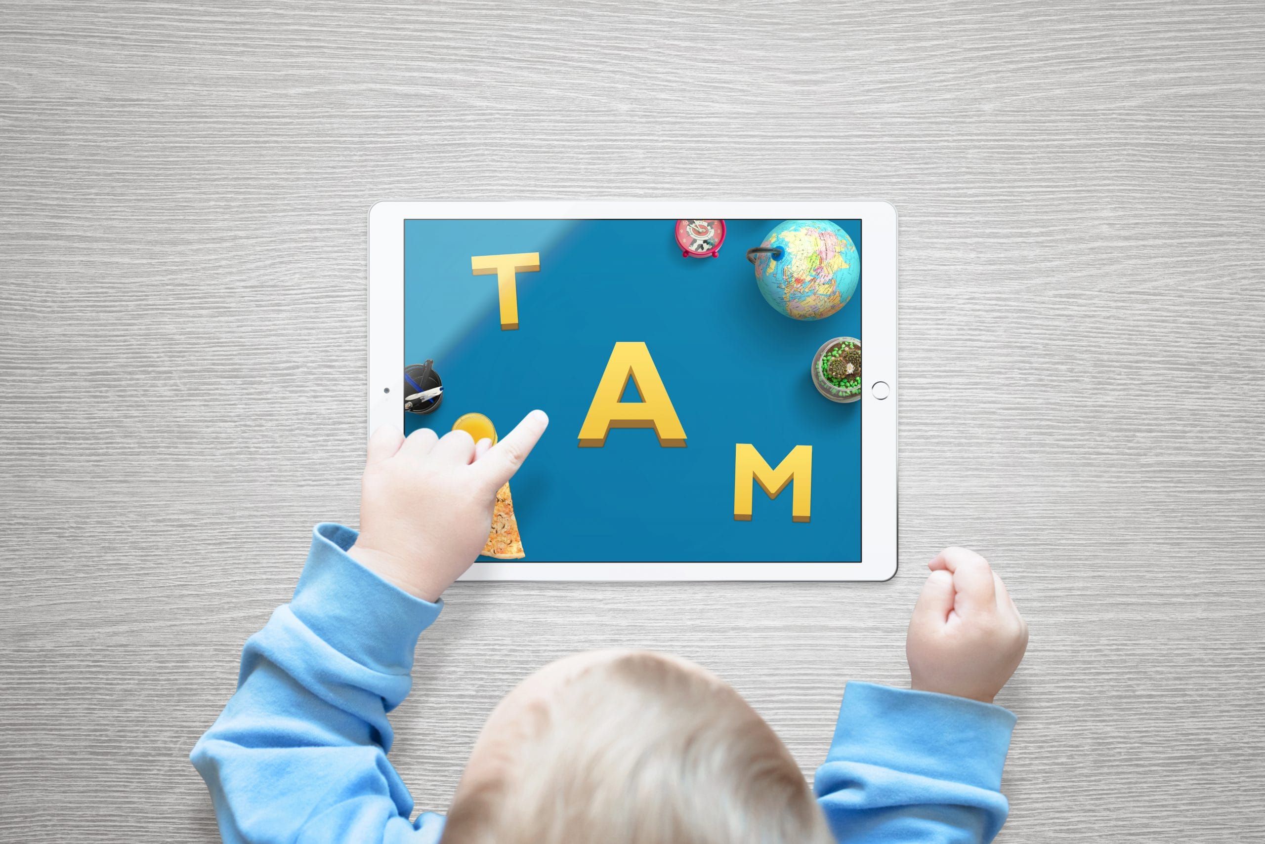 toddler playing a game on a tablet