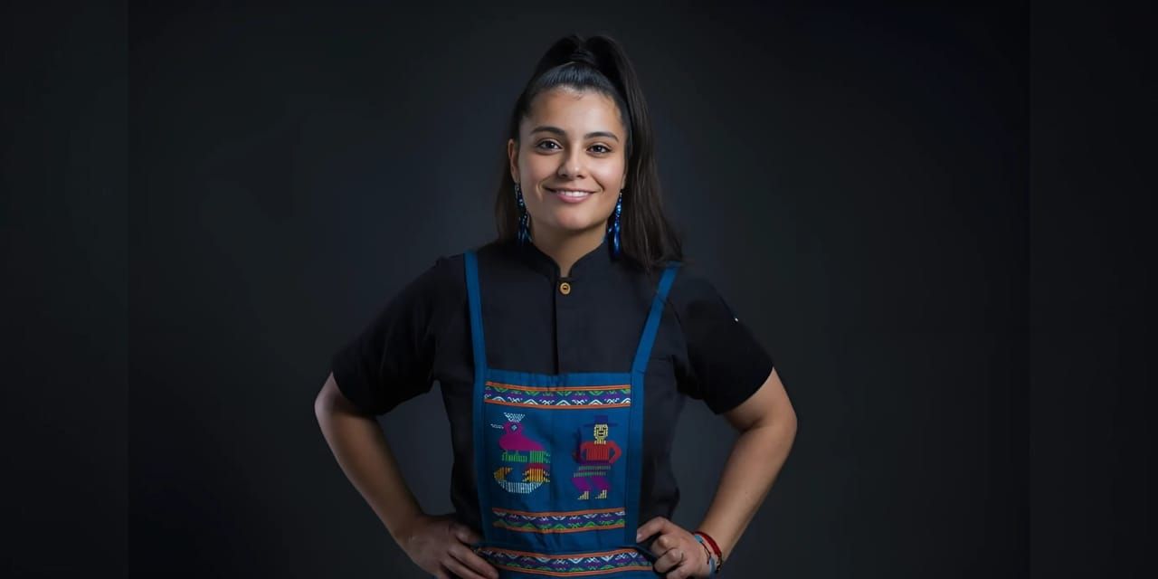 Portrait of Chef Carmen Miranda with a dark background