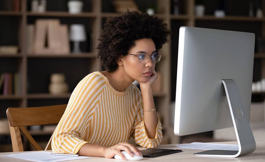 A female hiring manager looking online for talents on her personal computer