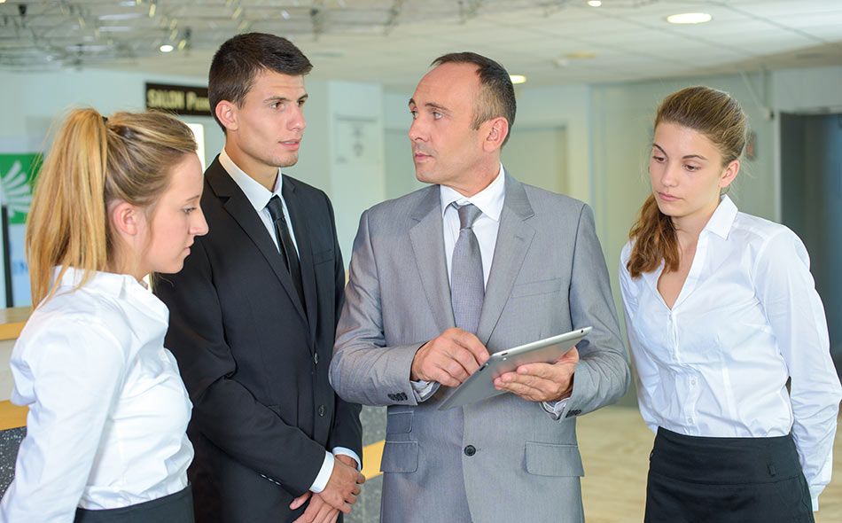 A manager discussing daily tasks with the team