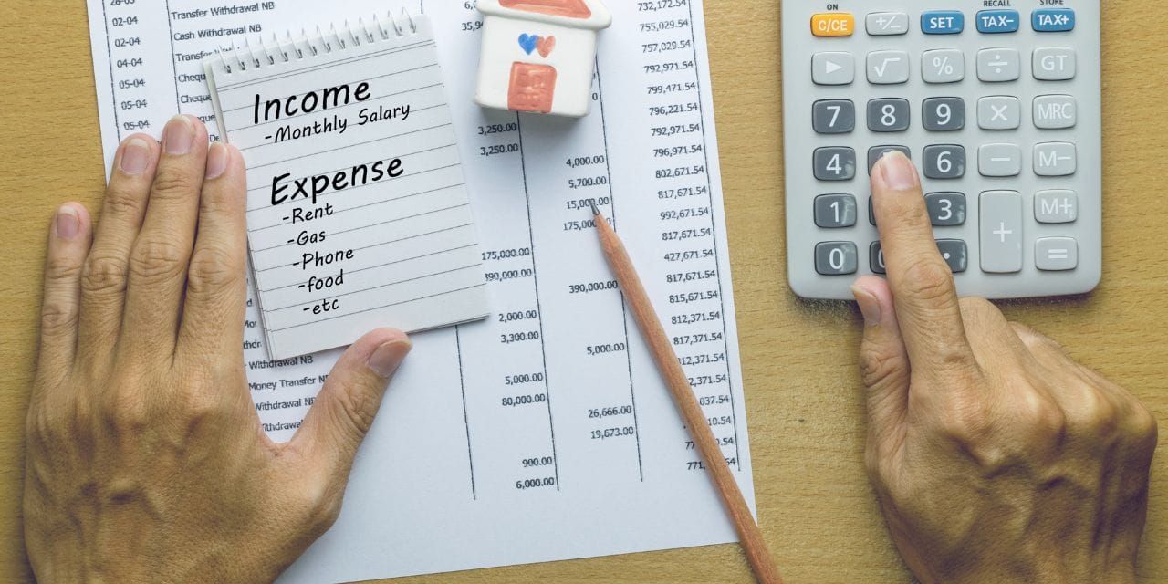 list of expenses and a calculator