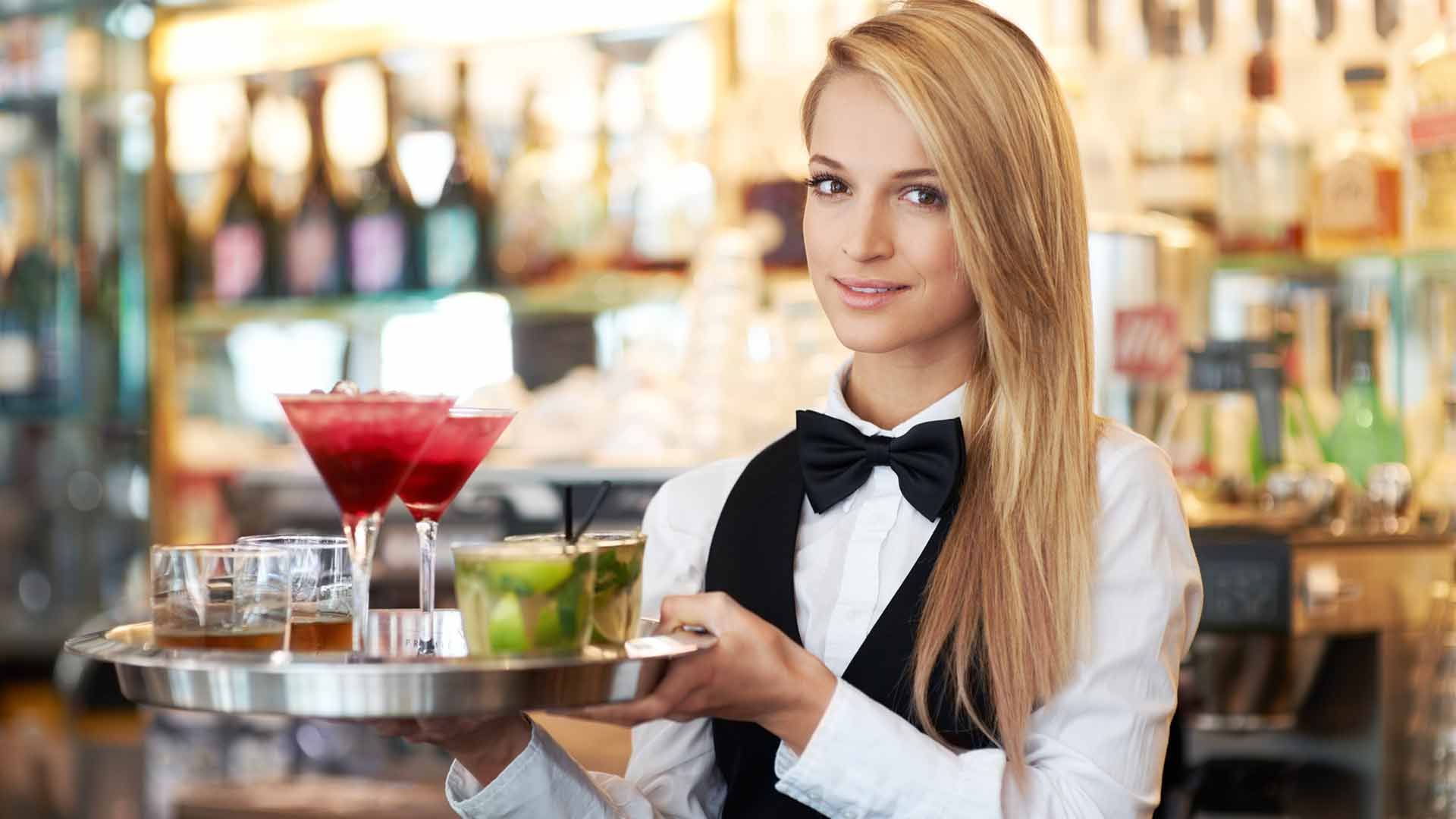 cocktail server holding tray