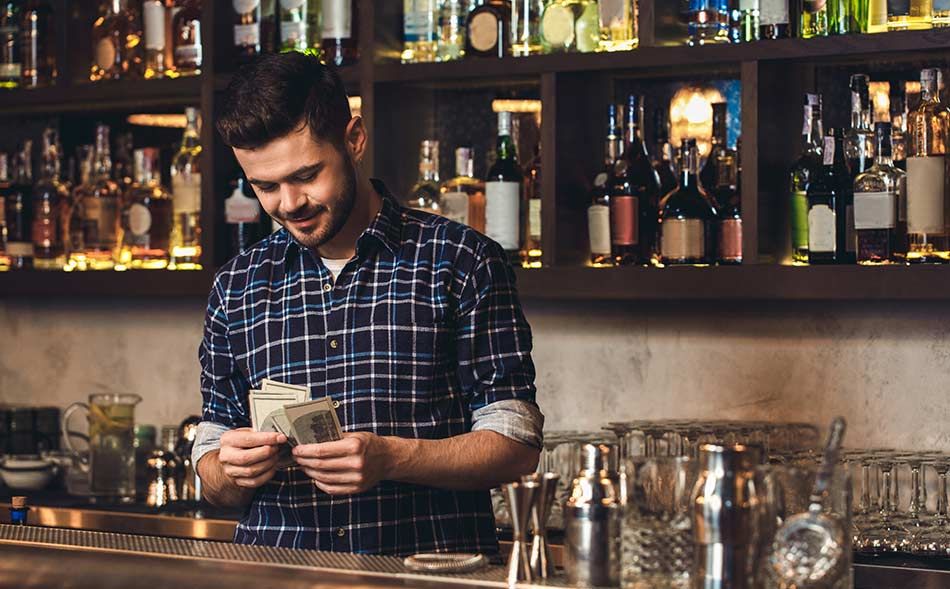 bartender counting money from tips