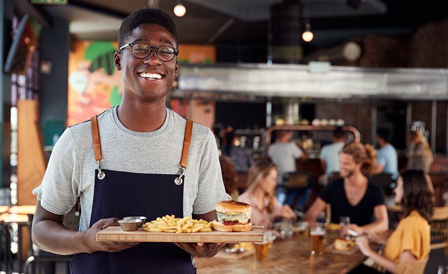A smiling restaurant server