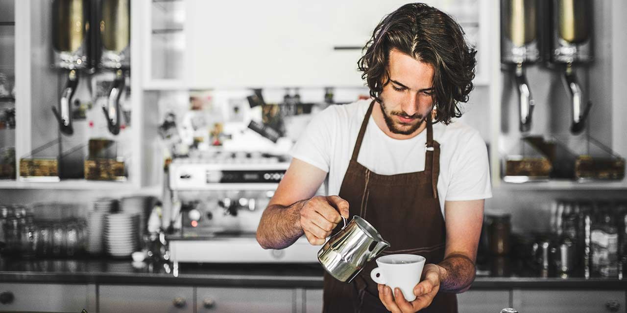 barista making coffee