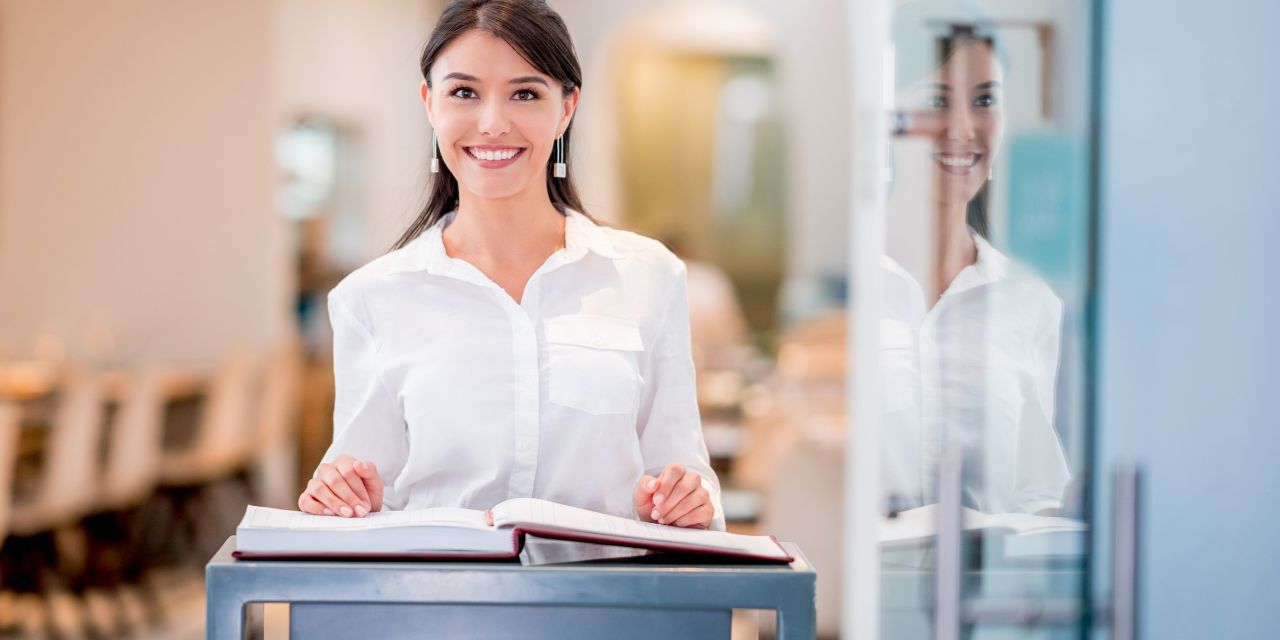 a smiling restaurant hostess